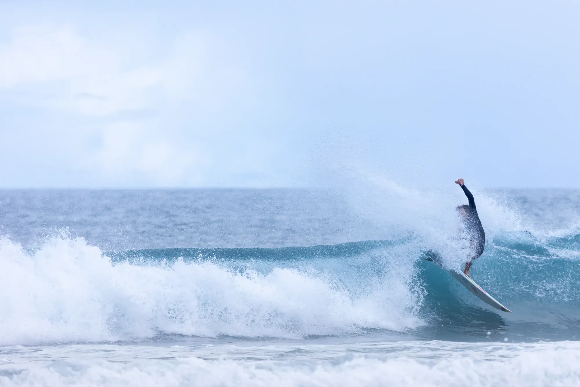 Surfing at Black Sand Box, São Miguel